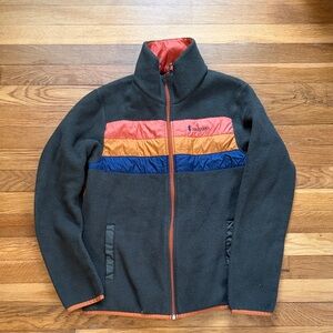 Cotopaxi Performance Jacket with Red, Orange, and Blue Accents